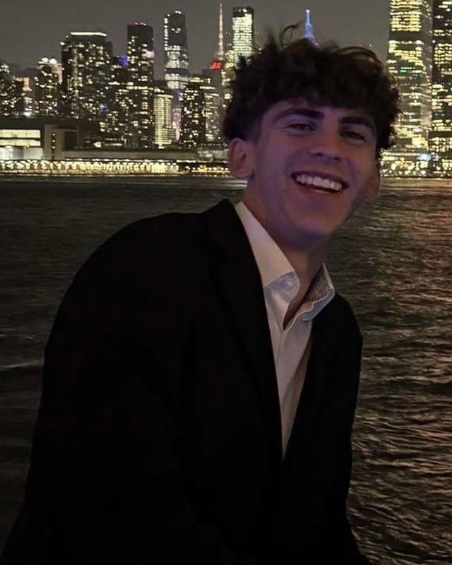 Blake Christopher Curtis by the New York skyline at night