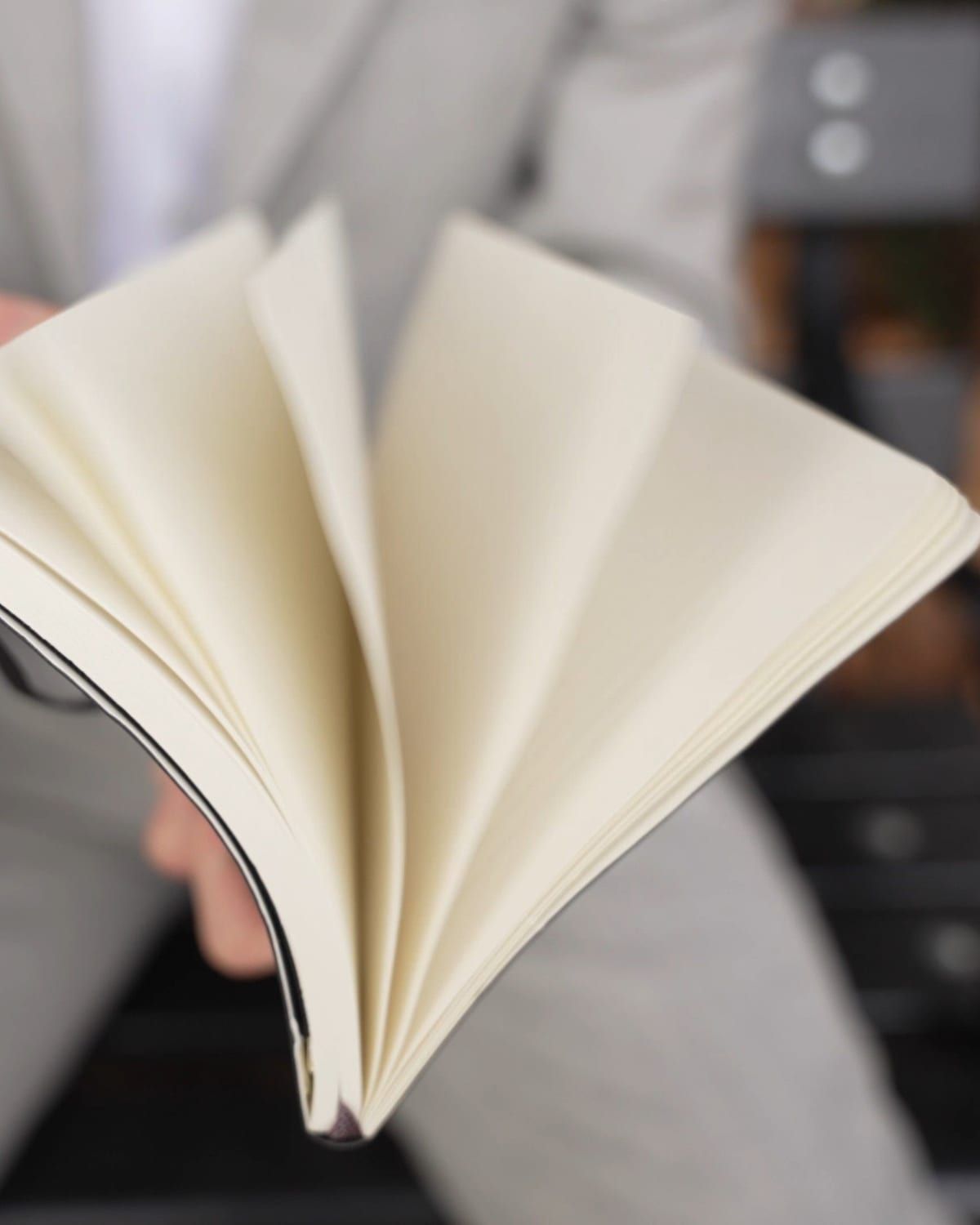 A notebook being flipped open